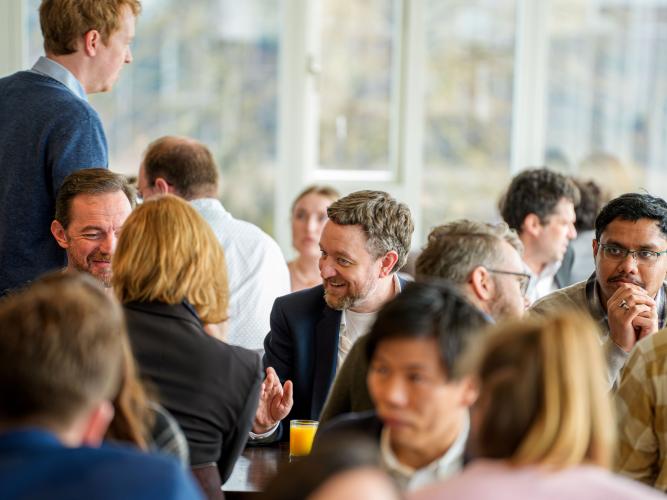 Conference delegates chatting during a break