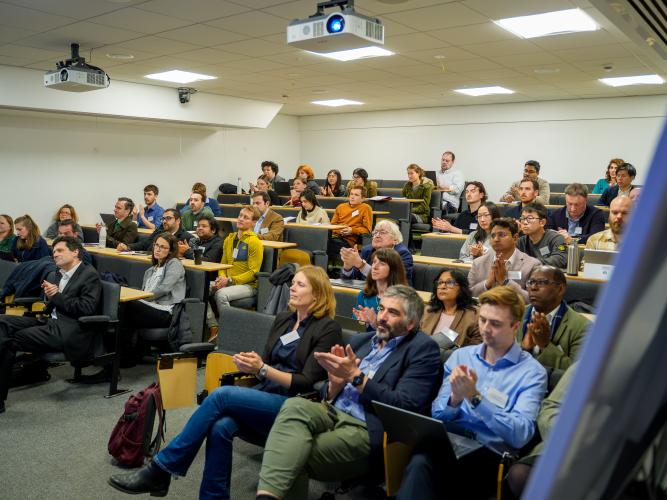 Audience watching a talk at the conference